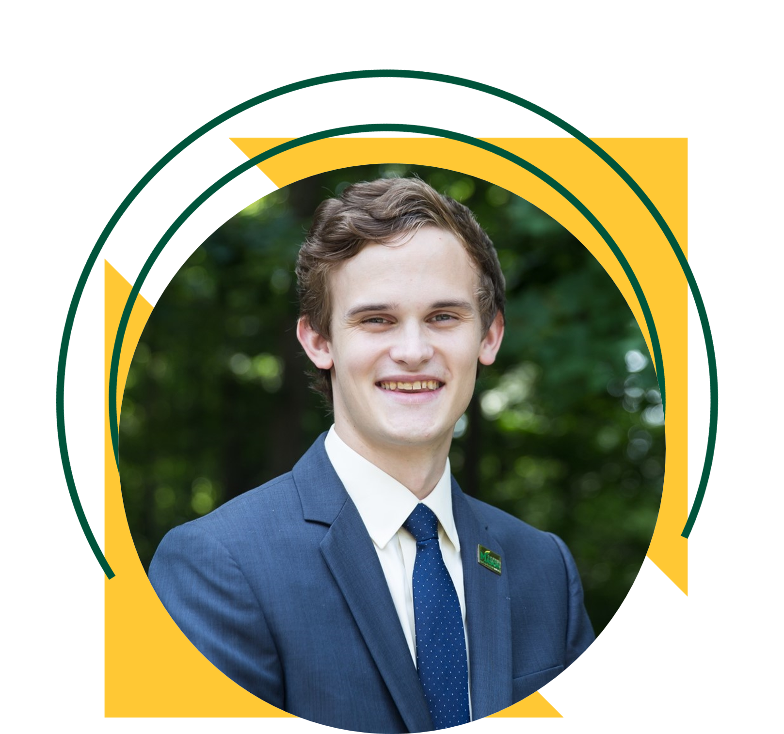 A smiling person wearing a navy suit jacket over a white dress shirt and navy blue spotted tie stands outdoors in front of green foliage. The portrait is framed by a graphic with yellow triangles and green circular lines on a black background.