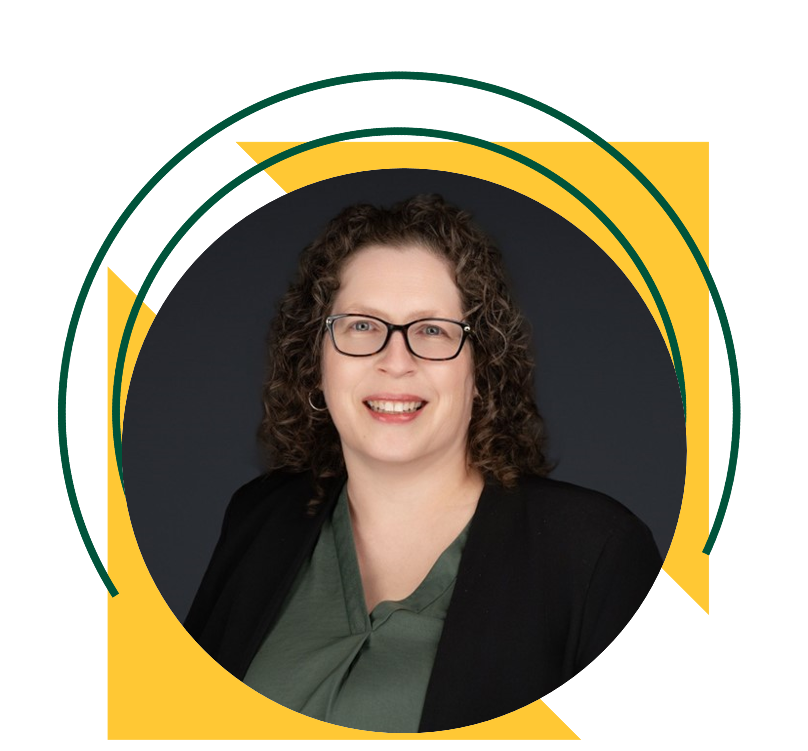 Professional headshot of a middle-aged woman with shoulder-length curly brown hair wearing glasses, a green blouse, and a black blazer.