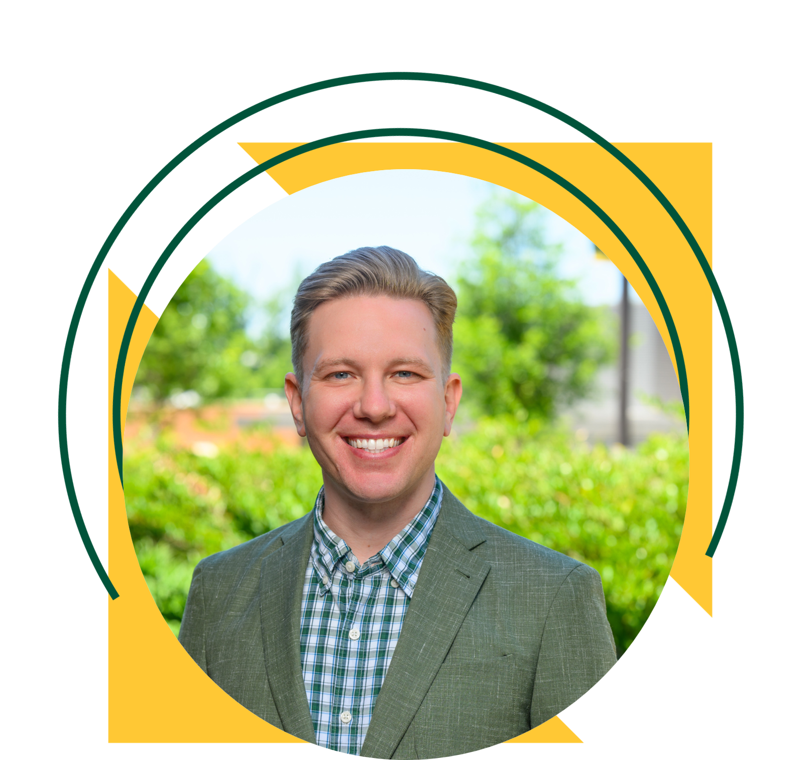 Professional portrait of a man wearing a green blazer and plaid shirt, standing outdoors in front of greenery. The image is framed within a circular design accented by yellow triangles and green curved graphic elements.